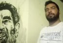 شاب تونسي يرسم صورة صدام حسين على جدار منزله